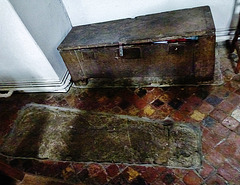 aldbury church,c13 coffin lid and c14 parish chest surrounded by c15 tiles in the north aisle