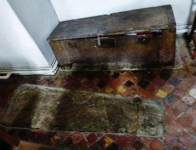 aldbury church,c13 coffin lid and c14 parish chest surrounded by c15 tiles in the north aisle