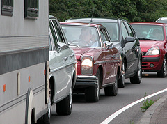 Mercedes-Benz 250 C stuck in modern traffic