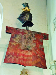 stoke d'abernon church , surrey,tabard, helmet and crest  of sir john norbury , who died in 1521. the tabard is a replacement