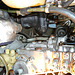 Unscrewing the oil cooler lines from a Mercedes-Benz OM617 turbodiesel engine