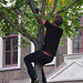 Leidens Ontzet 2012 – Polstokspringen – Climbing a tree to tie his underpants on a branch