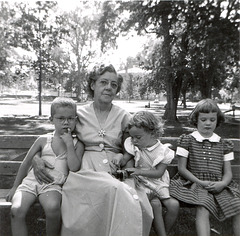 Grandma on a park bench with the grandkids, 1953.