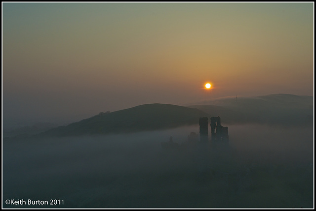 Castle in the mist at sunrise