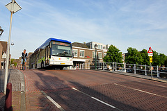 Bus climbing the bridge over the Herengracht