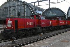 Railion 6498, 6499 and 6496 pulling a goods train through Amsterdam Central station