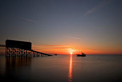 Selsey Lifeboat Station and Fishing Boat at sunrise