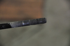 Head bolt with carbon build-up
