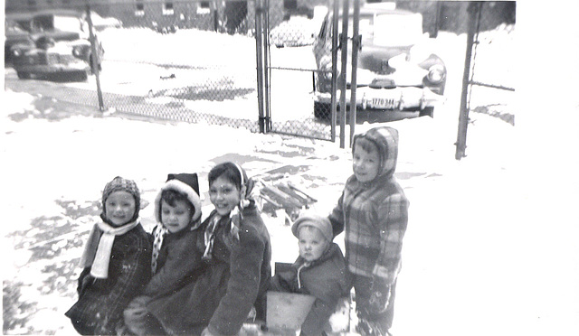 Four girls on a sled, and footman. Chicago, winter, 1951