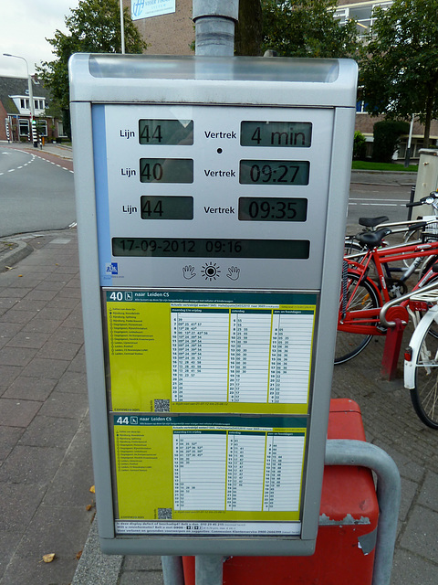 Bus stop with estimated times of arrival of the buses