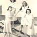 My mom and work friends, c. 1940, New Orleans, cavorting on the roof of their government office building.