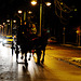 Horse and carriage and some cars