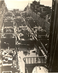 Boats in a ship. U.S. Marine Corps Sherman tanks on assault landing craft are inside the well of a Navy LSD.