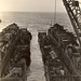 Landing craft ferrying supplies prepare to depart USS Catamount, LSD 17, sometime 1945 in the Pacific