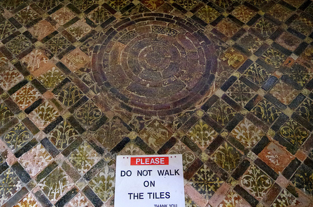 Tiled floor in front of the altar