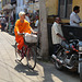 Orange-clad Blonde Cyclist