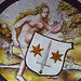 Detail of a Nude Woman Supporting a Heraldic Shield Stained Glass Roundel in the Cloisters, June 2011