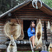 A young Eskimo woman discusses the varous fur pelts used by the native people for dress and shelter. Holding a wolverine pelt. Beaver and wolf to her right. Coyote, fox, otter, ermine to her left.