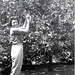 Mom picking oranges from my grandparent's tree.  Arcadia, CA, 1960