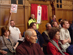 worried  audience at the town hall