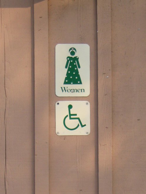 Accessible women's restroom sign