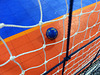 Blue soccer ball, orange floor
