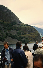 Mountains, fjord and ship passengers