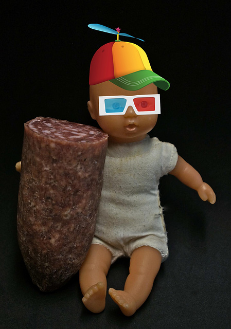 Young Boy with Salami Wearing Propellar Beanie and 3D Glasses