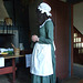Woman inside the Adrience Farmhouse's Kitchen at the Queens County Farm Museum Fair, September 2008