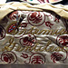 Detail of the Tablecloth for Artemisia Gentileschi in the Dinner Party by Judy Chicago in the Brooklyn Museum, August 2007