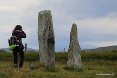 Visitor sizing up one of the stones in Callanish Stone Circle #2