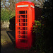 sun on an English telephone box