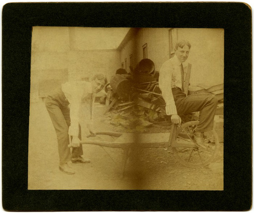 A Man Pushing Himself on a Wheelbarrow