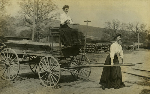 A Woman Pulling Herself on a Wagon