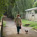 A woman walking with her dog