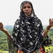 woman prying in kourumi village. Ethiopia