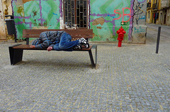 Prostrate young man sleeps