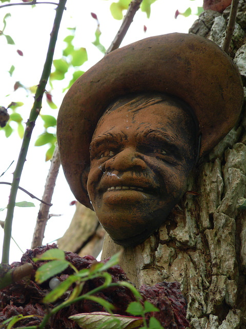Kippford- Sculpture of a Cheerful Man on a Tree