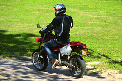 Driving away on a motorbike