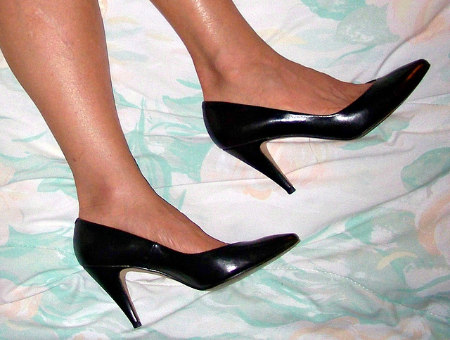 wife in black caressa heels