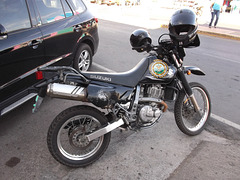 Policia nacional on Suzuki motorcycle.