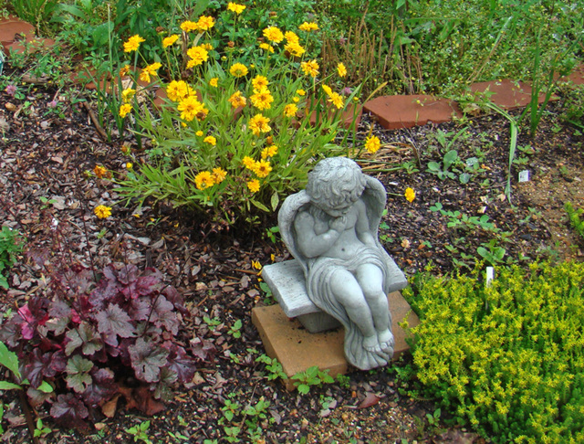 Flower bed with angel