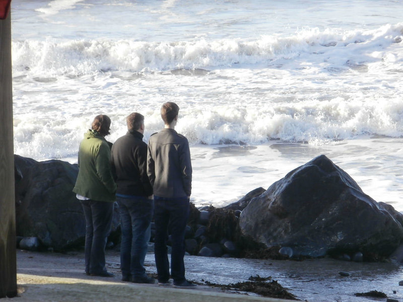 Some people admiring the waves