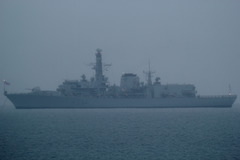 Type 23 frigate HMS Iron Duke (F234) seen through 2.5 nm of murkiness in Weymouth Bay