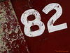 82 (white on red)