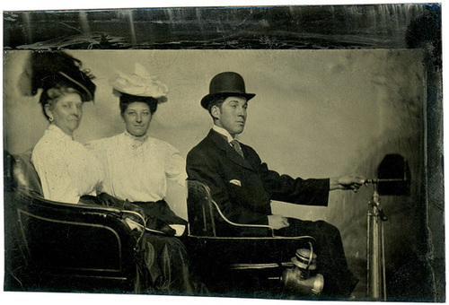 Tintype of Two Women and a Man in an Early Automobile