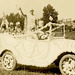 Lady Liberty and Her Family in a Decorated Parade Car
