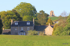 The (Old) Schoolhouse with Blervie Castle Ruins on the skyline