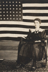 Woman on Rocking Chair with Flag