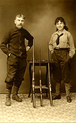 Man and Woman Posing with Their Guns